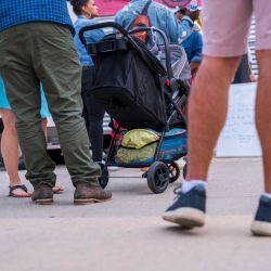 People standing in line for a food truck or other vendor