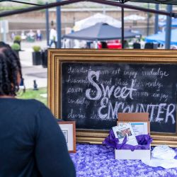 Vendor with "Sweet Encounter" sign at 517day