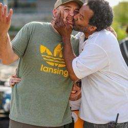 517day organizer Melik smooching Paul on the lips with Jessi hiding between them